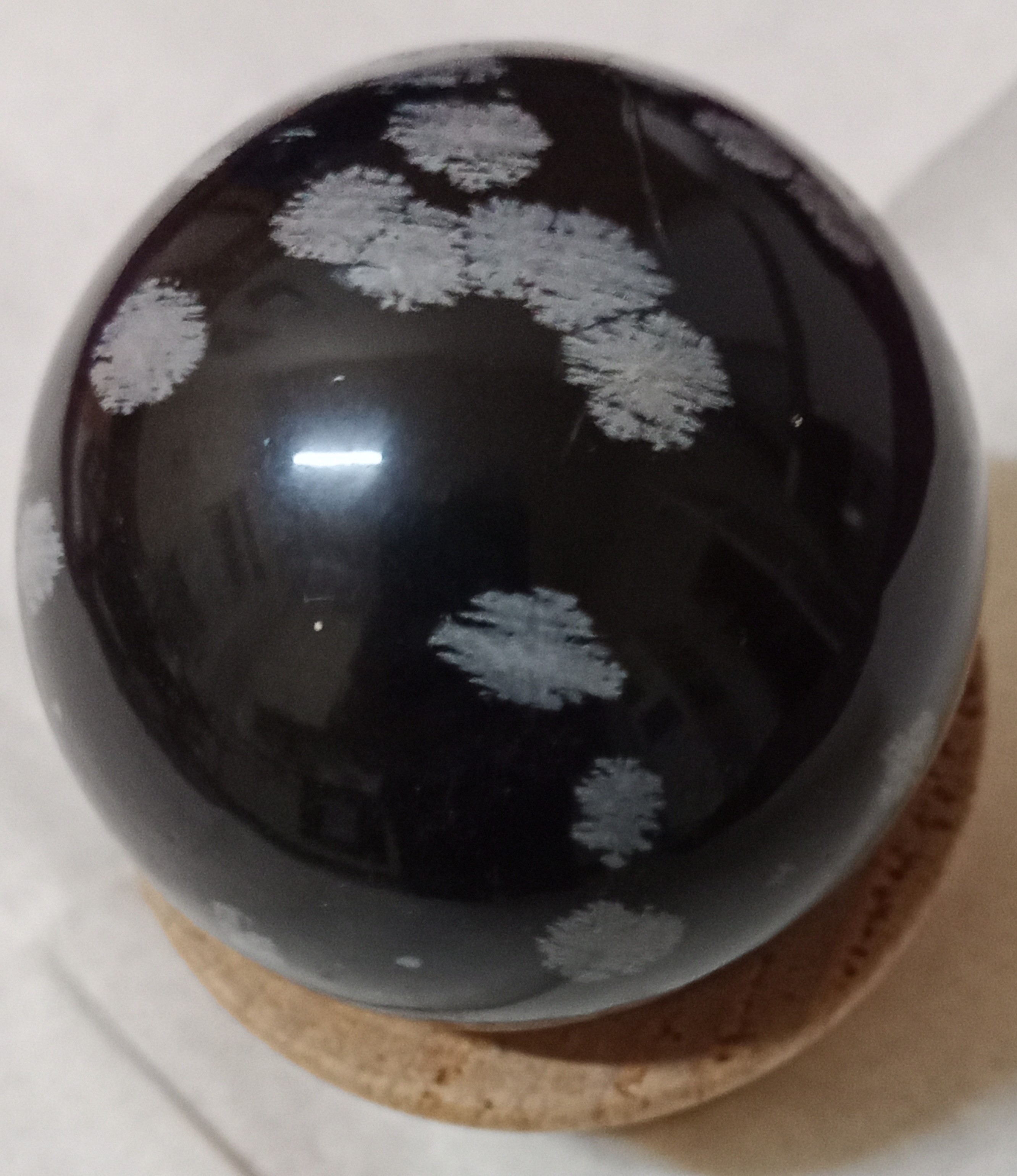 Snow flake obsidian sphere